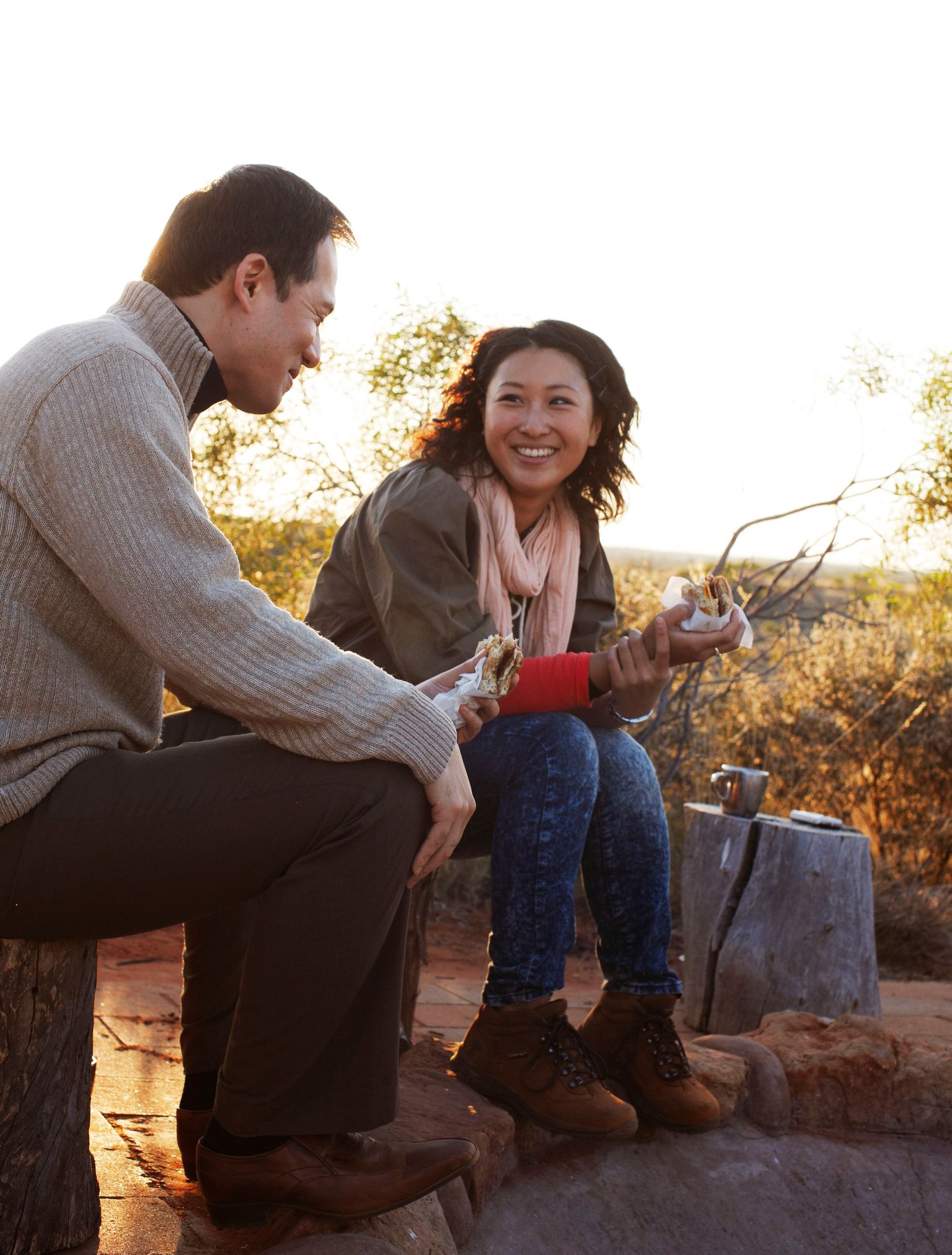 couple around the campfire at Desert Awakenings in Ayers Rock