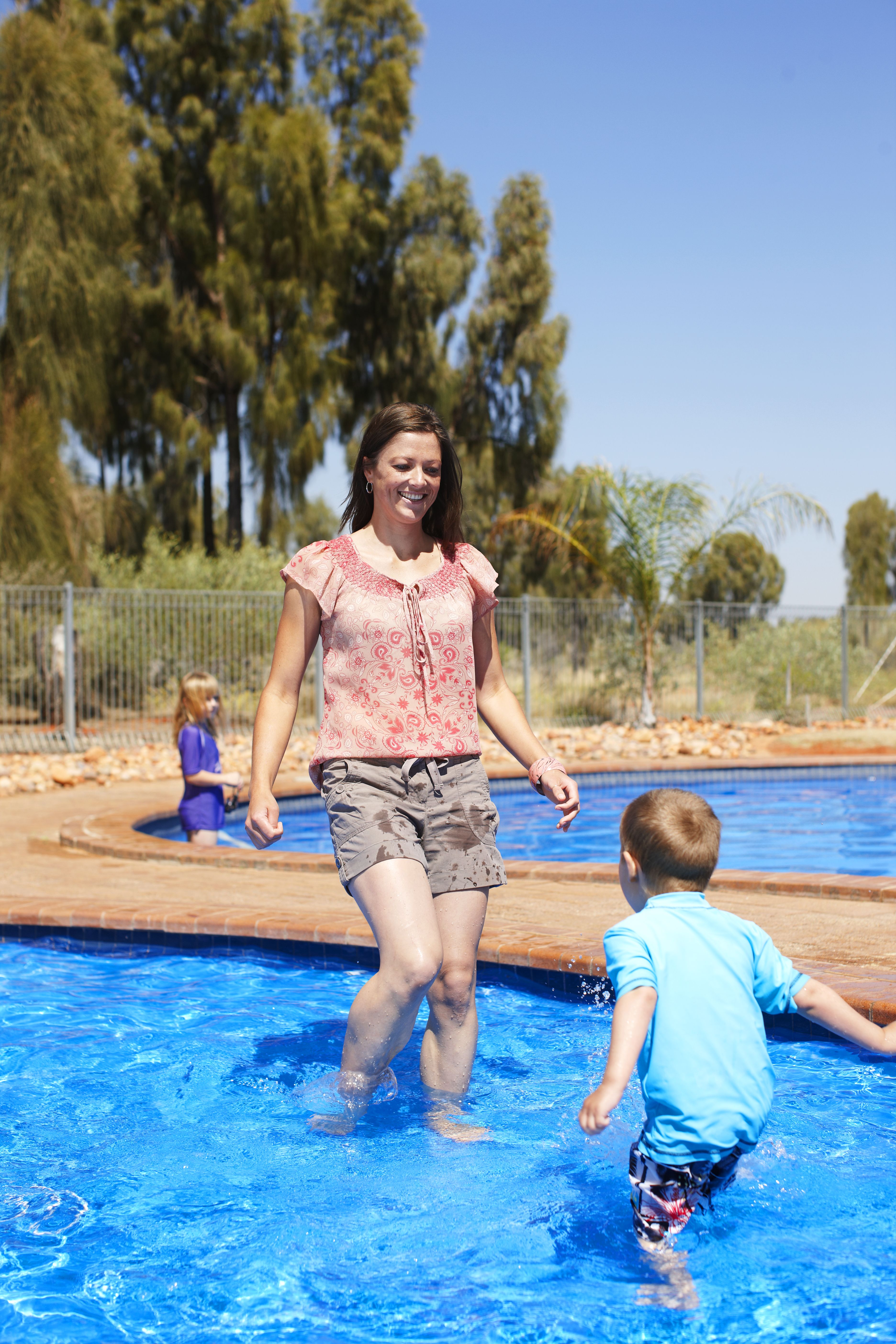 Family playing the pool