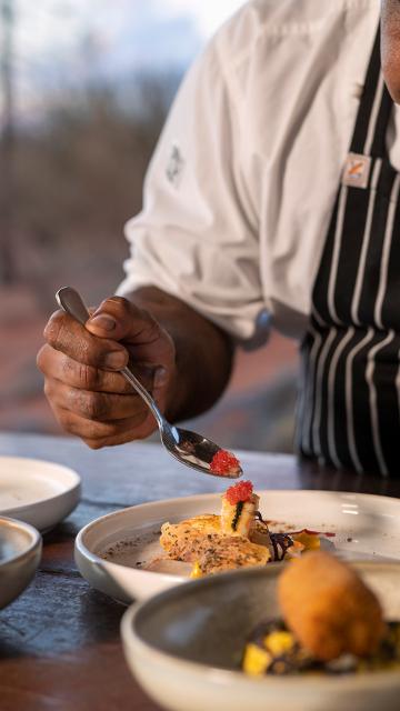 Tali Wiru chef preparing entrees